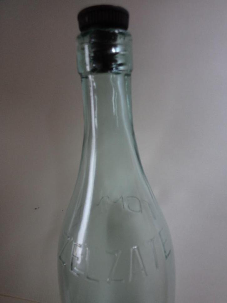 Fles 1968-1976 Zelzate Tommie, 1 liter, Verzamelen, Glas en Drinkglazen, Gebruikt, Ophalen