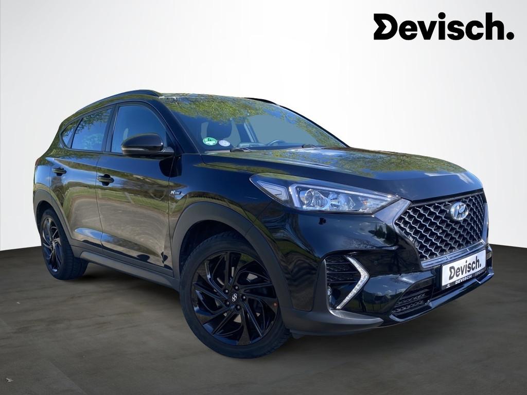 Hyundai Tucson 1.6 t-gdi isg n-line 2wd dct-7 5d 130kw, Gebruikt, 4 cilinders, Leder en Stof, Zwart