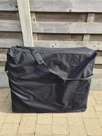 Massagetafel met hoes en toebehoren.