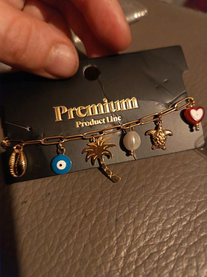 Premium Product Line rosé goudkleurige armband met bedeltjes, Handtassen en Accessoires, Armbanden, Nieuw, Staal, Roze, Met bedels of kralen