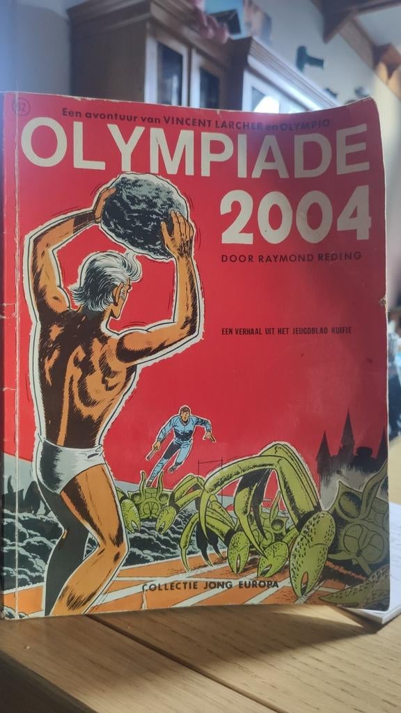 Olympiade 2004, Nederlandstalig. Blote vent waarschuwing., Boeken, Stripverhalen, Ophalen of Verzenden, Gelezen