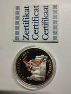 Een sterling zilveren munt over sport lopen met gekleurde te, Ophalen