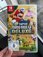 Super Mario Bros U Deluxe Nintendo Switch, Consoles de jeu & Jeux vidéo, Jeux | Nintendo Switch, Comme neuf, À partir de 3 ans