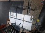 Ronde glazen tafel op poot, Ophalen