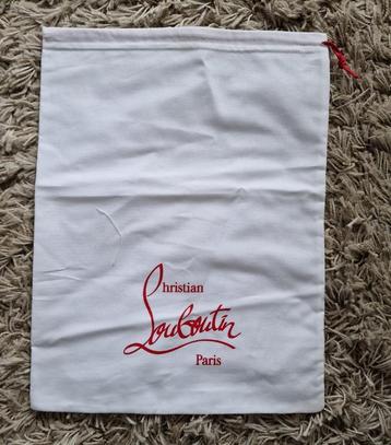 Sac à poussière Christian Louboutin. disponible aux enchères