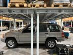 Jeep Grand Cherokee 5.9 LX  lichte vracht  112.000 km, Auto's, Automaat, Beige, Leder, Bedrijf