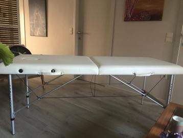 Plooibare massagetafel beschikbaar voor biedingen
