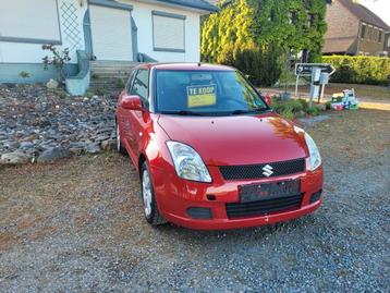 Suzuki swift 1.3 benzine 2009, Auto's, Voorwielaandrijving, Stof, Zwart, Swift
