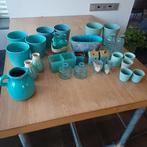 Vazen en bloempotten in petrol tinten, Enlèvement