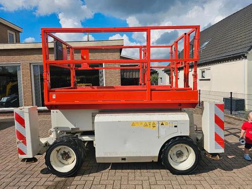 JLG Genie gs2668 ruwterein hoogwerker (bj 2011), Zakelijke goederen, Machines en Bouw | Liften, Steigers en Ladders
