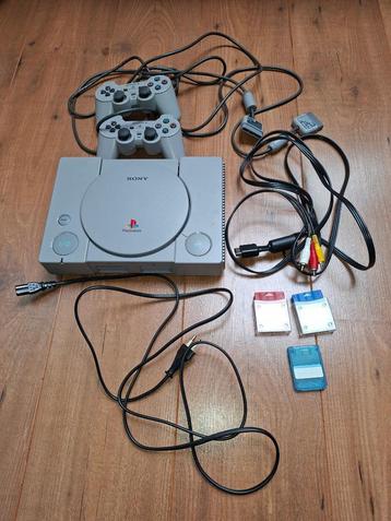 Playstation 1 + 2 controllers + memory cards + games beschikbaar voor biedingen