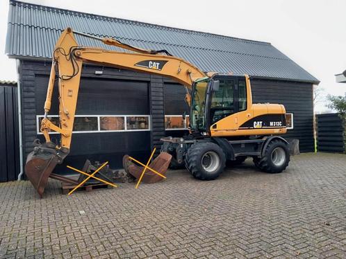Cat M 313 C graafmachine kraan (bj 2004), Zakelijke goederen, Machines en Bouw | Kranen en Graafmachines, Graafmachine