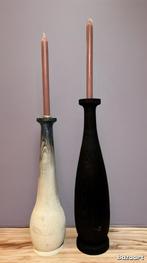 Vol houten kandelaars, Ophalen