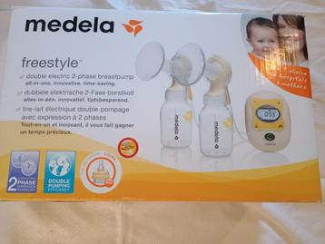 dubbele elektrische borstkolf medela freestlye + extra's beschikbaar voor biedingen