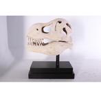 Statue de dinosaure en forme de T-Rex sur socle en forme de