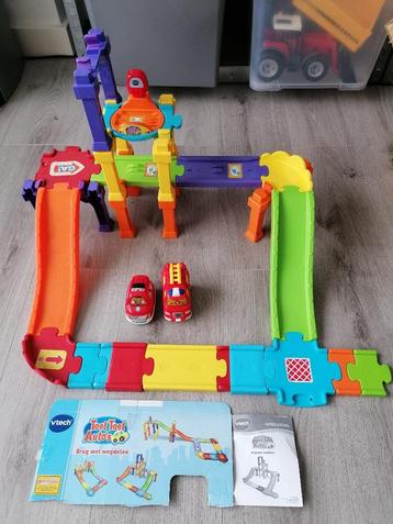 Vtech brug meg wegdelen en 2 Toet Toet auto's beschikbaar voor biedingen