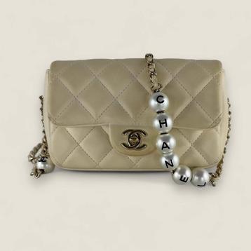 Chanel mini flap met parel chain beschikbaar voor biedingen