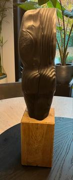 Vol houten sculptuur, Ophalen