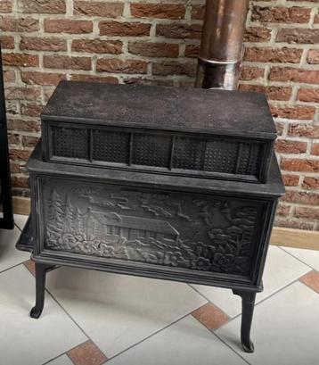Poele ancien a bois en fonte beschikbaar voor biedingen