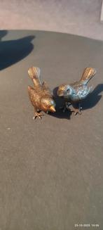 2 metalen vogels, Ophalen