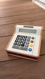 Houten speelgoed kassa, Ophalen