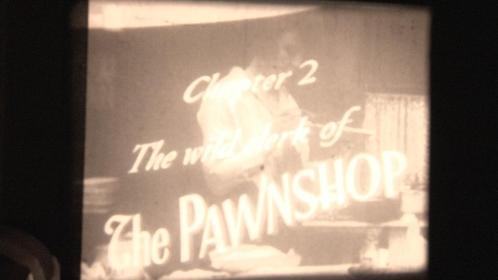 Charlie Chaplin in "THE PAWNSHOP" 1916 op 16mm zwartwitfilm, Audio, Tv en Foto, Filmrollen, 16mm film, Ophalen of Verzenden