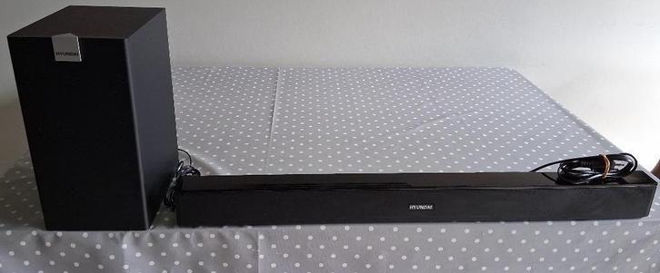 SOUNDBAR HYUNDAI + SUBWOOFER + AFSTANDSBEDIENING., Audio, Tv en Foto, Luidsprekerboxen, Zo goed als nieuw, Subwoofer, 60 tot 120 watt