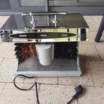 Schoenpoetsmachine, Ophalen