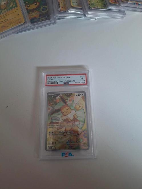 Psa 9 Eevee #173 – Prismatic Evolution, Hobby en Vrije tijd, Verzamelkaartspellen | Pokémon, Zo goed als nieuw, Ophalen of Verzenden