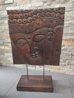 Boeddha gesneden in hout, Ophalen