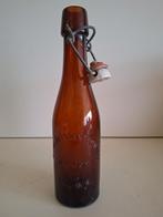 Oude bierfles in reliëf brouwerij M. Buyssens Versele Lauwe, Verzamelen, Biermerken, Ophalen of Verzenden, Zo goed als nieuw