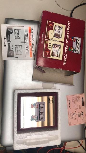 Mario Bros Nintendo-spel en horloge  beschikbaar voor biedingen