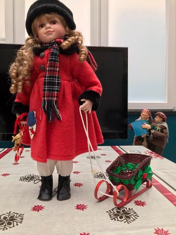 Porceleinen pop met slede. beschikbaar voor biedingen