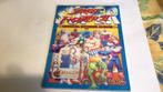 Street fighter II sticker album(x2), Ophalen of Verzenden, Gelezen, Merlin, Prentenboek