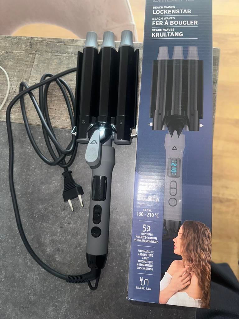 Fer a boucler, Enlèvement, Comme neuf