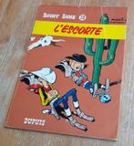 Lucky Luke 28 L'escorte EO 1966 Morris Dupuis, Gelezen, Morris, Ophalen of Verzenden, Eén stripboek