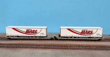 Wagon Rocky-Rail Twin chargé de remorques MARS Logistics