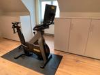 Technogym biketrainer met scherm, Sport en Fitness, Ophalen, Zo goed als nieuw, Benen, Spinningfiets