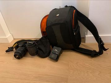 NIKON D3100 + 2 lenzen + extra batterij met lader + zak beschikbaar voor biedingen