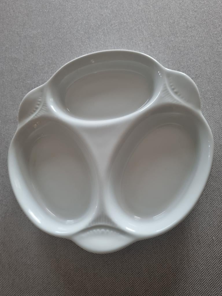 Porseleinen schotel, Ophalen