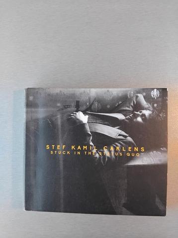 Cd. Stef Kamil Carlens. Stuck in the Status quo. (Digipack).