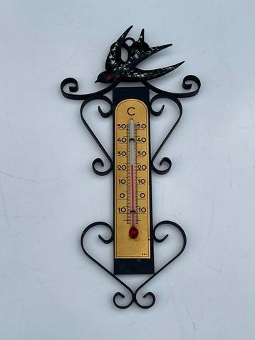 Oude thermometer smeedijzer met zwaluw beschikbaar voor biedingen