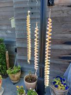 Windspinners en bloemenslingers, Ophalen