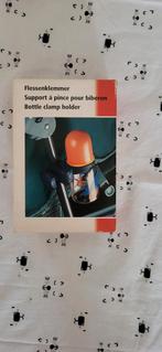 Flessenklemmer voor aan buggy, Ophalen