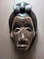 Afrikaans masker, Ophalen