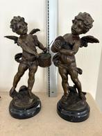 2 brons engelen, Ophalen