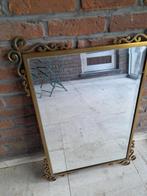 Spiegel in kader van messing, Ophalen