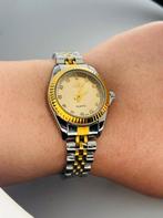Kwartshorloge in goud en zilver., Handtassen en Accessoires, Horloges | Dames, Ophalen of Verzenden, Nieuw, Staal, Staal