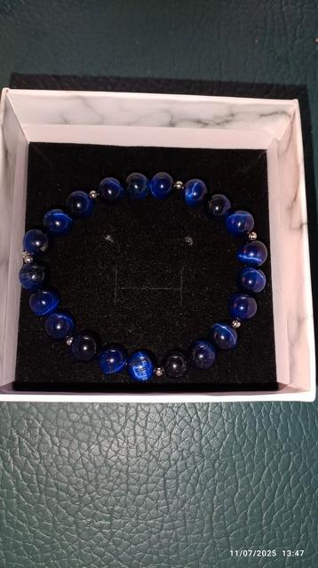 Elastische armband met tijgeroogkralen  beschikbaar voor biedingen