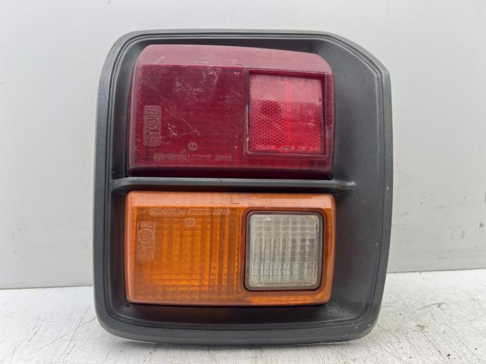 Feu arrière gauche d'un Nissan Cherry, Autos : Pièces & Accessoires, Éclairage, Utilisé, 3 mois de garantie, Enlèvement ou Envoi